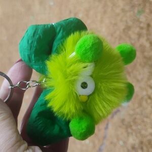 Bright green fuzzy critter keychain